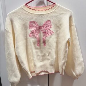Cream Sweater with Pink Bow Design